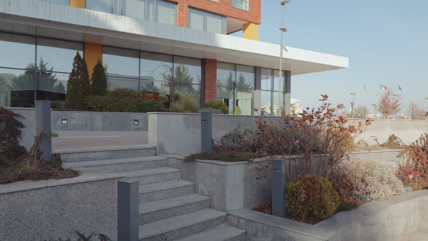 An athletic woman training by running up granite stairs, showcasing fitness and a healthy, active lifestyle.
