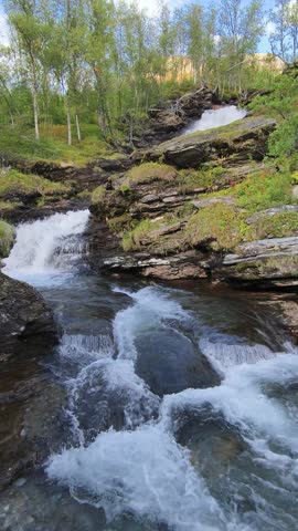 Waterfall in a wild gorge in beautiful nature in northern Norway
