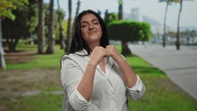 Woman boxing outdoors in a park with lush greenery, showcasing confidence and strength in a serene public setting under natural daylight. - Powered by Shutterstock - Get 15% off with code: PIKWIZARD15