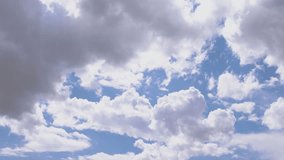 Serene time-lapse filmed through an airplane window, showcasing sunlit fluffy clouds gliding across the sky, capturing the tranquil beauty of aerial landscapes during daylight. - Powered by Shutterstock - Get 15% off with code: PIKWIZARD15