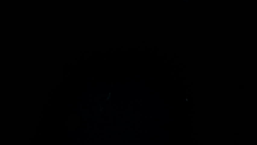 Shadow of a zombie hand on black background
