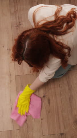 Top above view woman washing wiping floor near vacuum cleaner hoover with soap cleaning product cleanup parquet girl female housewife busy with domestic routine home chores apartment care mopping neat