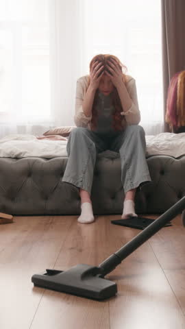 Caucasian woman holding head problem with home cleaning morning house clean trouble girl female homeowner housewife stress suffering headache upset mess untidy bedroom housekeeping chores depressed