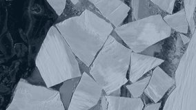 Aerial top down giant ice floes, pack ice and towering icebergs drifting in frozen sea ocean. Abstract blue natural pattern, climate change, glacier melting, wild nature of the North polar landscape - Powered by Shutterstock - Get 15% off with code: PIKWIZARD15