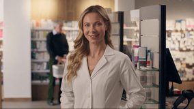 Smiling Caucasian woman doctor pediatrician therapist practitioner female intern medical health care adviser physician in white coat medicine pharmacy looking at camera healthcare portrait drugstore - Powered by Shutterstock - Get 15% off with code: PIKWIZARD15