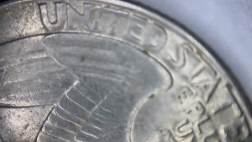 Macro close-up of stacked US coins, quarter dollar, one cent, one dime. Financial concept, perfect for banking, investment or wealth management visuals.