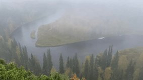 Scenic autumn river bend with misty forest view from Pahkanankallio in Finnish Lapland - Powered by Shutterstock - Get 15% off with code: PIKWIZARD15