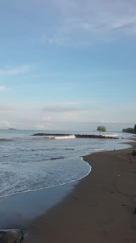 Watching the waves crash in the morning on a quiet beach