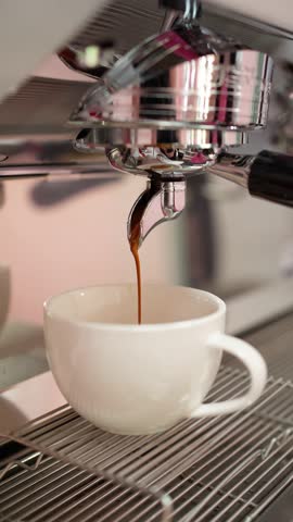 Making coffee in a coffee machine. Aromatic coffee concept.