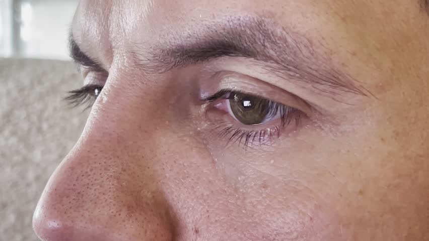 Close up of male eyes in macro photography, detailed human gaze with sharp pupils, intense mysterious look, beautiful man eye texture, extreme close up portrait of masculine face and vision