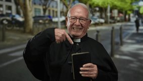 Senior priest man pointing at a book while standing on a city street, surrounded by urban elements and greenery in a vibrant outdoor setting. - Powered by Shutterstock - Get 15% off with code: PIKWIZARD15