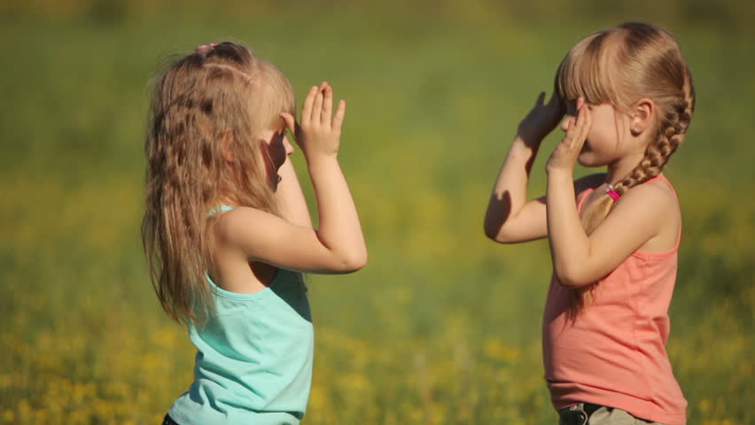 Sisters clapping their hands and laughing
