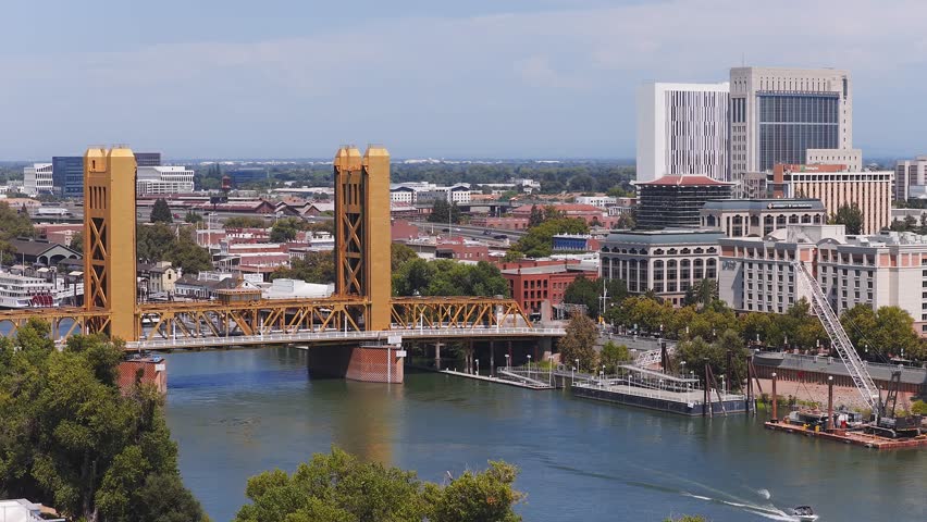 An aerial view of the Tower Bridge near State Capitol Building in Sacramento, California on a beautiful summer day over the Sacramento River.