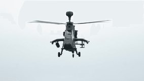 Eurocopter Tiger gracefully maneuvers through cloudy skies in training - Powered by Shutterstock - Get 15% off with code: PIKWIZARD15