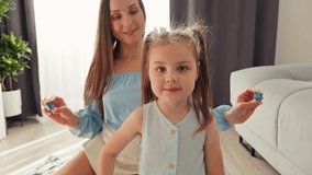 A Wonderful Mother and Daughter Enjoy Playtime Together with Colorful Toys in Their Cozy Living Room Space - Powered by Shutterstock - Get 15% off with code: PIKWIZARD15