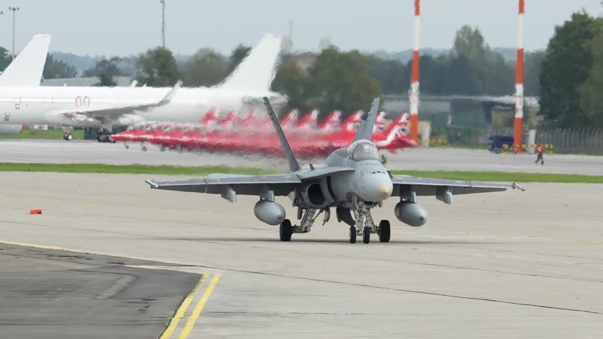 F-18 jet prepares for takeoff at the airfield during a clear afternoon