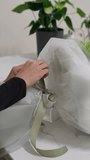 Florist ties a ribbon bow on a finished white and green bouquet - Powered by Shutterstock - Get 15% off with code: PIKWIZARD15