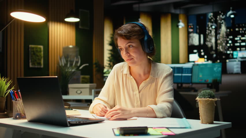 Business consultant summarizing important ideas in a meeting call with investors, extracting essential bullet points from the discussion with business associates. Insight in a briefing. Camera A.