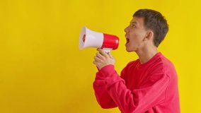 Dynamic young man shouting encouragement into megaphone celebrating success with energetic gesture - Powered by Shutterstock - Get 15% off with code: PIKWIZARD15