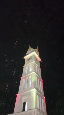  Jam Gadang Clock Tower in Bukittinggi City, West Sumatra, Indonesia, at rainy night