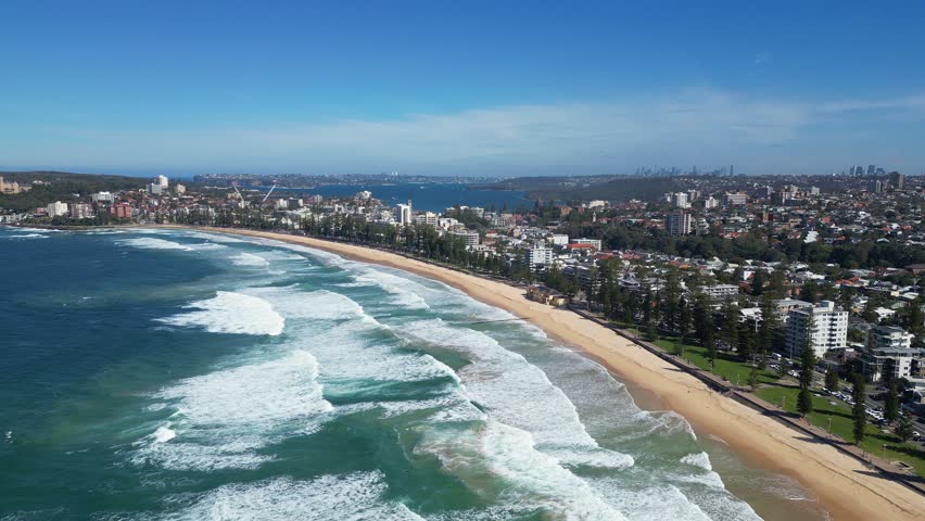 Sydney, Australia :Footage of waves crashing Manly beach. Showing its seaside resort area with backward motion. Located in northern Sydney, New South Wales, Australia