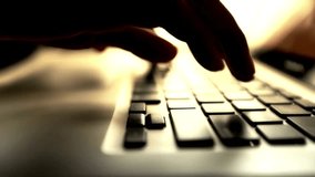 Hands are typing quickly and deliberately on a laptop keyboard, backlit by warm light. Creates a silhouette. Great for freelance work, writers. - Powered by Shutterstock - Get 15% off with code: PIKWIZARD15