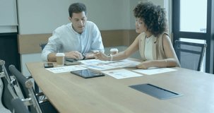 Woman pointing chart and man taking notes as AR code activating for business data analysis. Collaboration, analytics, innovation, technology, teamwork, data visualization, modern - Powered by Shutterstock - Get 15% off with code: PIKWIZARD15