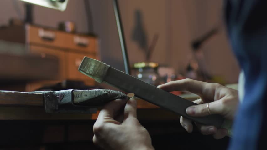 Woman positioning component and filing edge for finishing while animated technology icons appearing. Craftsmanship, precision, innovation, industrial, technical, artisan, manufacturing - Powered by Shutterstock - Get 15% off with code: PIKWIZARD15