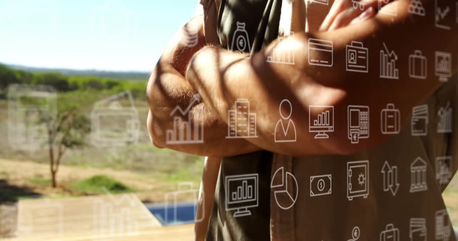 Mid adult man lowering arms and smiling while business icons emerging on glass illustrating finance. Professional, executive, confident, modern, commercial, innovation, consultation