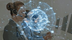 Call center operator adjusting headset, typing activating rotating data globe for global tracking. Technology, communication, digital, collaboration, data visualization, professionalism, innovation - Powered by Shutterstock - Get 15% off with code: PIKWIZARD15