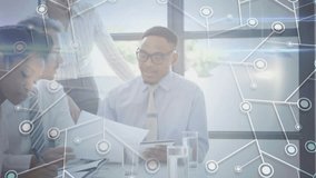 White man turning document toward team, driving business agreement with network overlay glass table. Collaboration, teamwork, corporate, innovation, professionalism, communication, connectivity - Powered by Shutterstock - Get 15% off with code: PIKWIZARD15