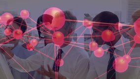 Senior executive raising stylus toward business data network overlay as team examines mobile phone. Collaboration, networking, innovation, teamwork, corporate, digital, analysis - Powered by Shutterstock - Get 15% off with code: PIKWIZARD15