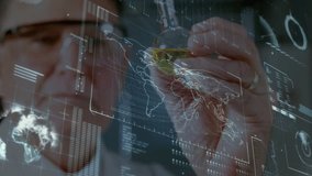 Senior scientist raising stylus, tracing North America on hologram in tech lab highlighting data. Technology, innovation, data visualization, futurism, knowledge, research, digital interfaces - Powered by Shutterstock - Get 15% off with code: PIKWIZARD15