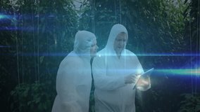 Scientists tapping tablet in greenhouse starting node and tracing network growth for crop research. Biotech, innovation, collaboration, technology, horticulture, data visualization, sustainability - Powered by Shutterstock - Get 15% off with code: PIKWIZARD15