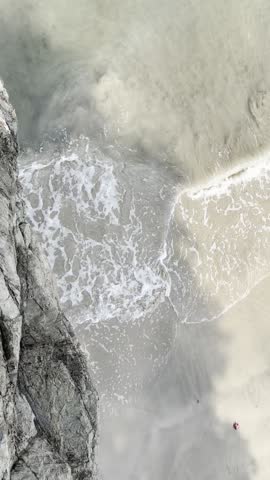 Top-Down View of Waves Washing Over Rocks on Yeosu Shore (여수)
