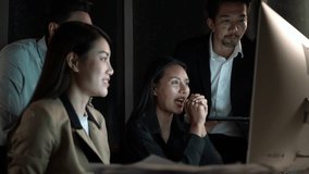 Group of diverse Asian office workers having night discussion in modern corporate space, teamwork, collaboration, data analysis, tech-driven meeting atmosphere, deadline pressure, hard work scene - Powered by Shutterstock - Get 15% off with code: PIKWIZARD15