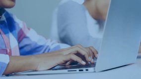 Foreground teen boy placing hands on keyboard, typing and animating network graphics in tech lab. Technology, collaboration, digital, innovation, futuristic, education, networking - Powered by Shutterstock - Get 15% off with code: PIKWIZARD15