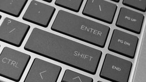 Close-up video of a QWERTY keyboard, capturing key details as fingers type across illuminated keys. - Powered by Shutterstock - Get 15% off with code: PIKWIZARD15