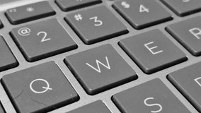 Close-up video of a QWERTY keyboard, capturing key details as fingers type across illuminated keys. - Powered by Shutterstock - Get 15% off with code: PIKWIZARD15
