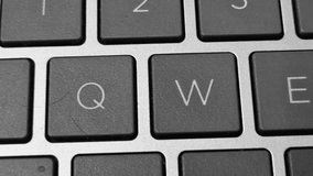 Close-up video of a QWERTY keyboard, capturing key details as fingers type across illuminated keys. - Powered by Shutterstock - Get 15% off with code: PIKWIZARD15