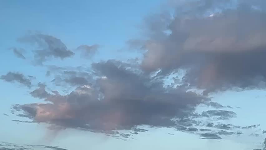 Majestic, Gorgeous, Beautiful Alberta, Canada, sunset sky, with vibrant orange and pink clouds over open prairie landscape, capturing the calm and colourful evening light across the rural horizon.