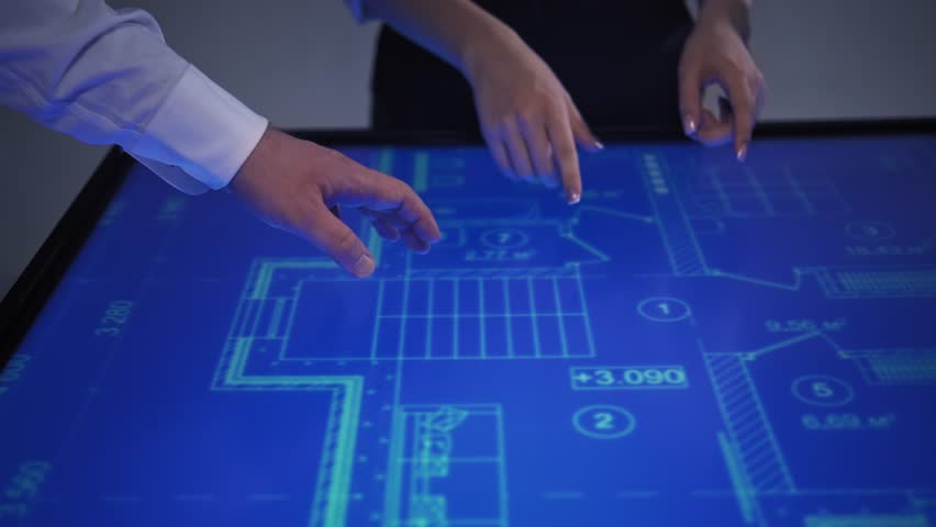 Office employees on interactive monitor screen discuss work details of project