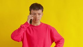 Frustrated young man on phone call expressing concern and confusion with gestures hand - Powered by Shutterstock - Get 15% off with code: PIKWIZARD15