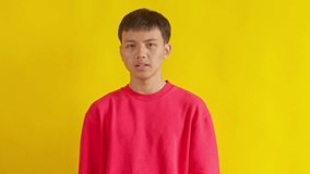 Young man sneezing into tissue experiencing allergy or cold symptoms isolated on Yellow background
 - Powered by Shutterstock - Get 15% off with code: PIKWIZARD15