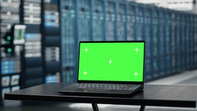 Isolated screen laptop in data center used for doing maintenance on infrastructure, improving workload. Chroma key notebook in server farm used by high tech server clusters for parallel processing - Powered by Shutterstock - Get 15% off with code: PIKWIZARD15