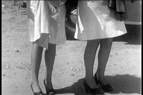 1930s - A 1930s stag film depicts two strippers hitchhiking for sex.