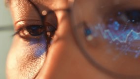 A person wearing glasses uses a laptop, with a digital graph reflected in the glasses, representing data analysis, financial trends, technological progress, and the impact of digital transformation.
 - Powered by Shutterstock - Get 15% off with code: PIKWIZARD15