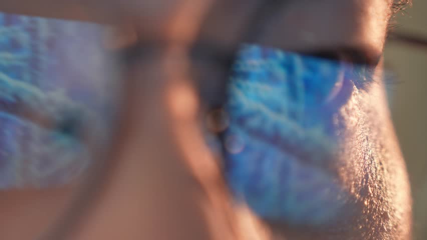 A person wearing glasses has a digital DNA strand reflected in their lenses, symbolizing genetic technology, personalized medicine, data-driven health, bioinformatics, and the future of biotechnology.