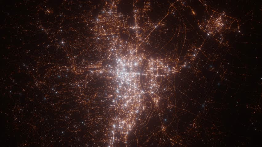 Zagreb (Croatia) aerial view at night. Top view on modern city with street lights. Camera is zooming out, rotating clockwise. Vertical video. The north is on the left side