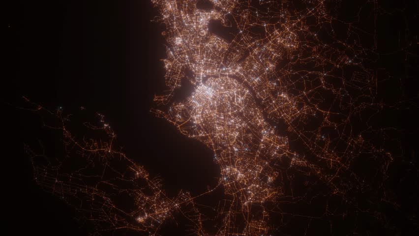 Oulu (Finland) aerial view at night. Satellite view on modern city with street lights. Camera is flying above the city, moving forward